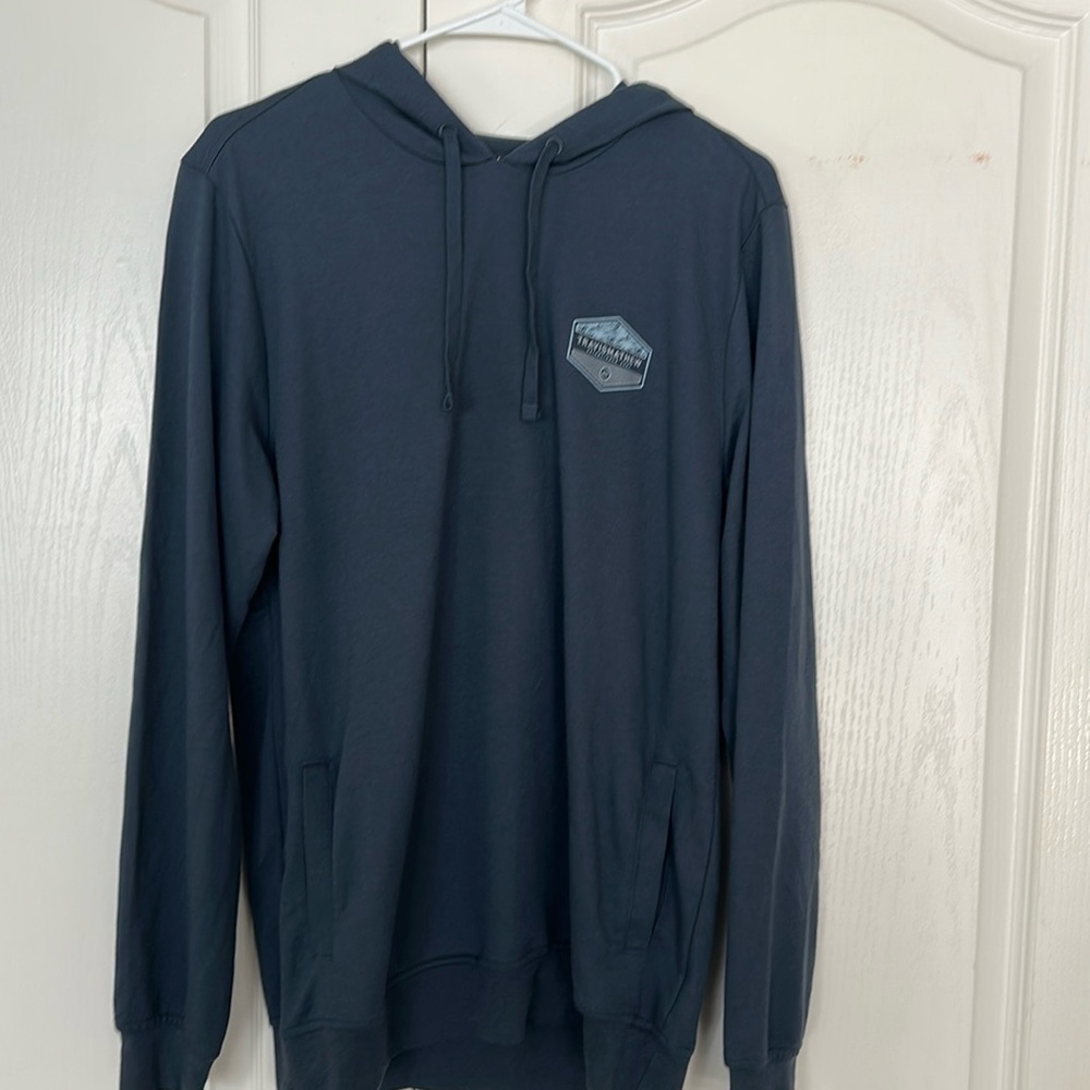 Travis Mathew light weight hoodie. Medium Blue